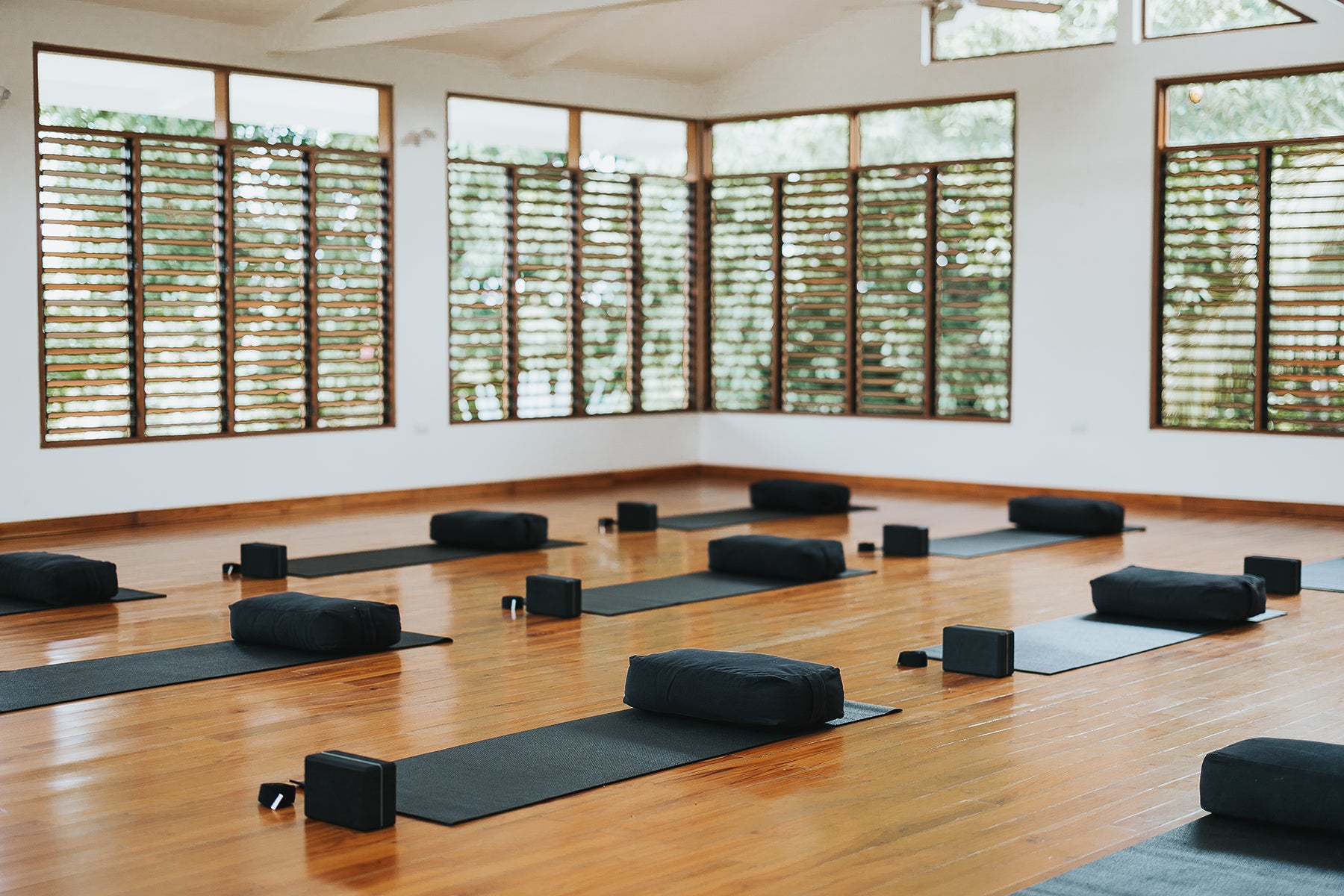 Yoga instructors at Sama Yoga House, all E-RYT 500 certified with over 10 years of experience, leading transformative classes and workshops.